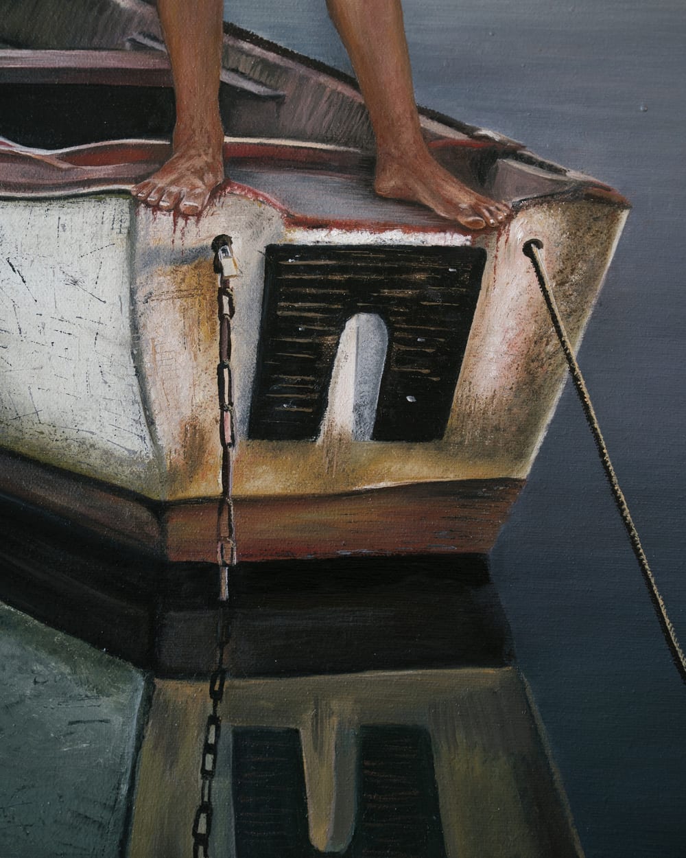 Detail of Guerrera: bare feet on the stern, a chain running down into the water.
