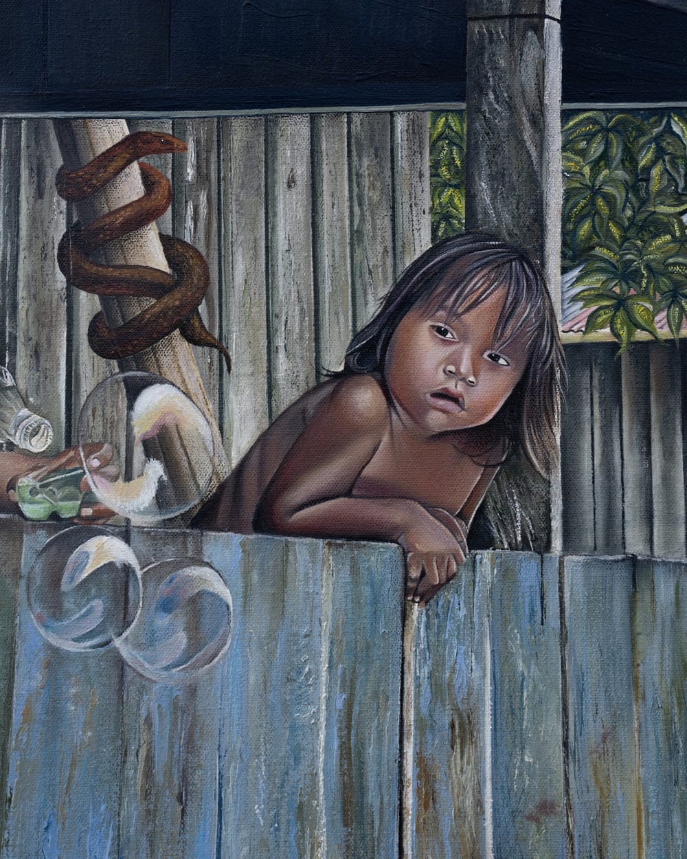 Detail of Inocencia: a girl resting her chin on the wall.